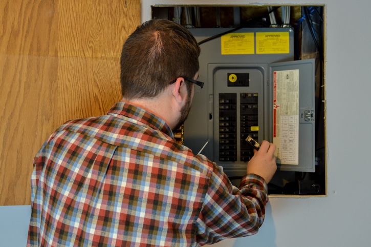 Handyman Inspecting an Electric Box